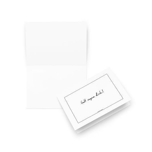 Die "Gott segne dich!" Grußkarte von ohmycard zeigt den handgeschriebenen Spruch auf einer weißen Karte. Sowohl offen als auch geschlossen dargestellt, ist sie ideal für persönliche Nachrichten zu besonderen Anlässen.